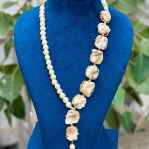 Asymmetric baroque pearl necklace featuring natural irregular pearls with elegant gold-finish setting