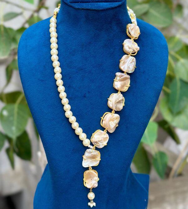 Asymmetric baroque pearl necklace featuring natural irregular pearls with elegant gold-finish setting