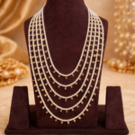Traditional five-layer white pearl rani haram necklace with elegant drop detailing