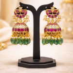 Traditional Jadau kundan jhumka earrings with ruby stones, pearls and green bead drops