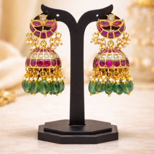 Traditional Jadau kundan jhumka earrings with ruby stones, pearls and green bead drops