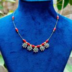 Red bead floral stone necklace featuring green center stones