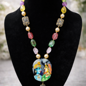 Tanjore painting inspired Radha Krishna pendant necklace with multicolour beads and pearl accents